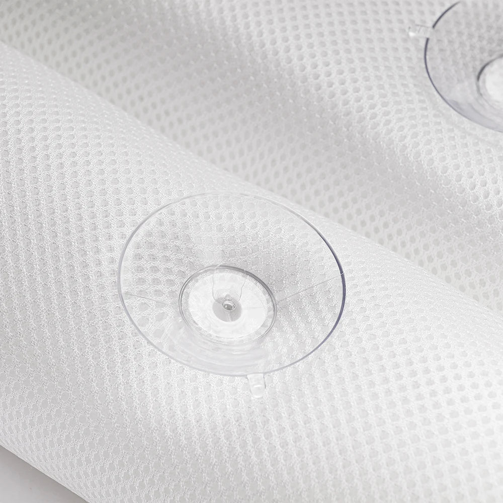 A close-up image of the Soft Bathtub Pillows For Whirlpool Spa Tubs shows a White textured surface, resembling cushioned material with small circular patterns. Two clear suction cups are attached to the surface, with one prominently displaying its round shape and another partially visible in the background.