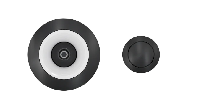 A Custom Nozzle Color video doorbell camera, featuring a black circular design with a contrasting white ring around the lens, sits next to a matching black circular doorbell button. The items are set against a transparent background.