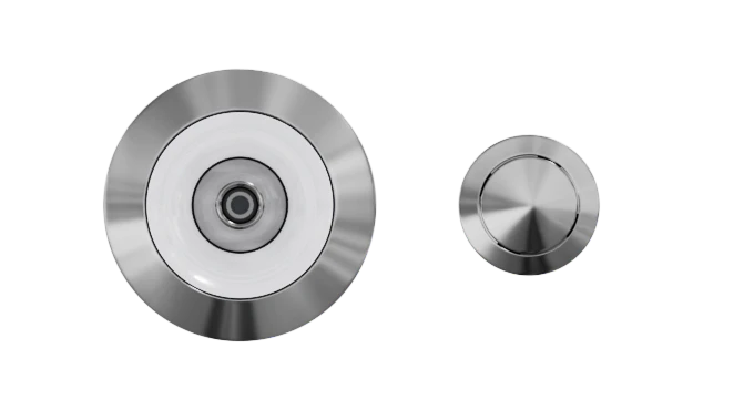 A close-up image of two Custom Nozzle Color valves, one larger than the other, against a white background with yellow horizontal lines. The valves feature a shiny silver finish with concentric circles in the design.