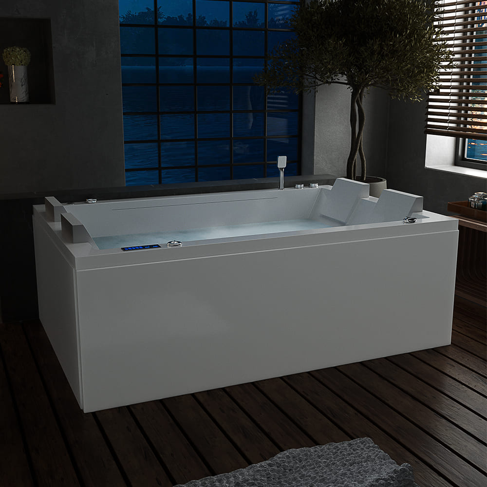 A modern bathroom features the 71 in. Freestanding Combination Massage 2-Person LED Tub With Center Drain by Empava, filled with water and perfect for indulging in Revi-Skin Therapy. Soft illumination enhances its sleek white surface. The room has dark tile flooring, a large window revealing a nighttime scene, and wooden blinds partially open.