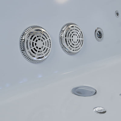 Close-up view of the interior of the Empava 71 in. Freestanding Combination Massage 2-Person LED Tub With Center Drain, featuring two round, metallic jet outlets with intricate grille designs on the side. Several small round drainage and functional openings are visible on the tub's surface, ideal for neck massage and deep pore cleansing. The clean, white bathtub offers Revi-Skin Therapy benefits.