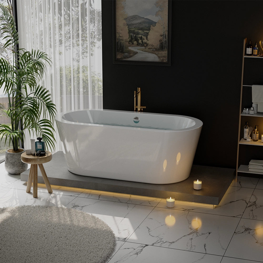 A modern bathroom highlights the 59" Freestanding Soaking Tub with Center Drain, showcasing an elegant oval design on a raised platform with ambient lighting and surrounded by candles. A lush plant complements a small wooden table stocked with toiletries, while large windows draped in sheer curtains invite natural light into the space.