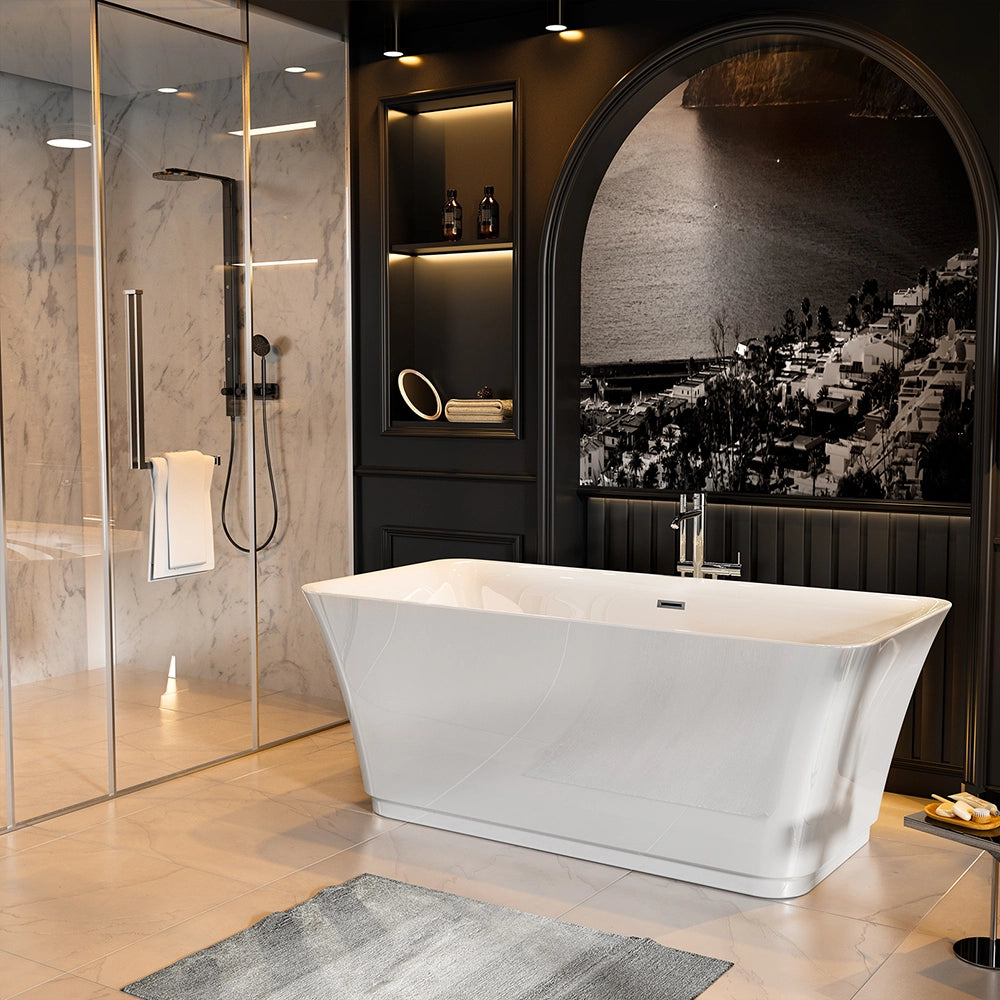 A modern bathroom featuring a 59" Freestanding Soaking Tub with Center Drain, a glass shower enclosure with marble walls, and built-in shelves with ambient lighting. A monochrome mural of a coastal town adorns the wall behind the tub. A grey rug lies on the tiled floor.