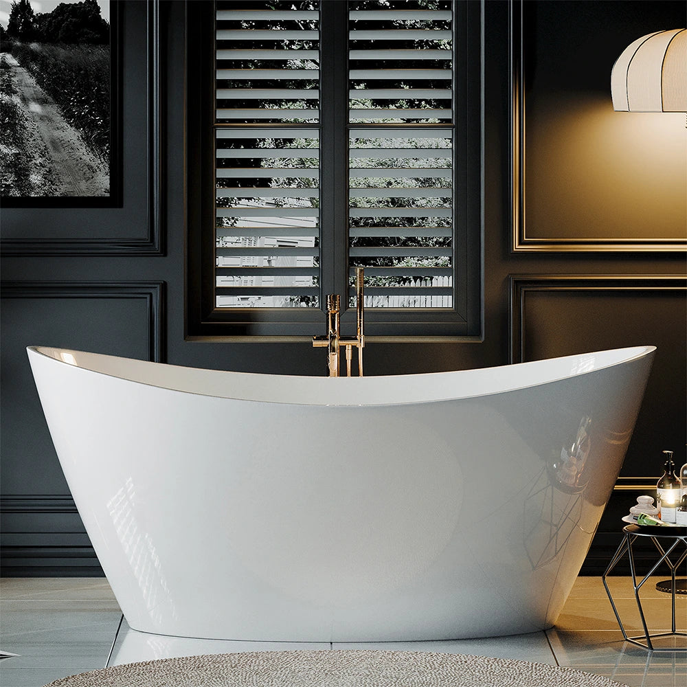 A modern bathroom features the sleek 67" Freestanding Soaking Tub with Center Drain, crafted from lightweight acrylic and elegantly positioned in front of a window with shutters. The room is accented by dark walls, a stylish light fixture, and a tray with bath items on a small table. A monochrome picture hangs to the left of the window.