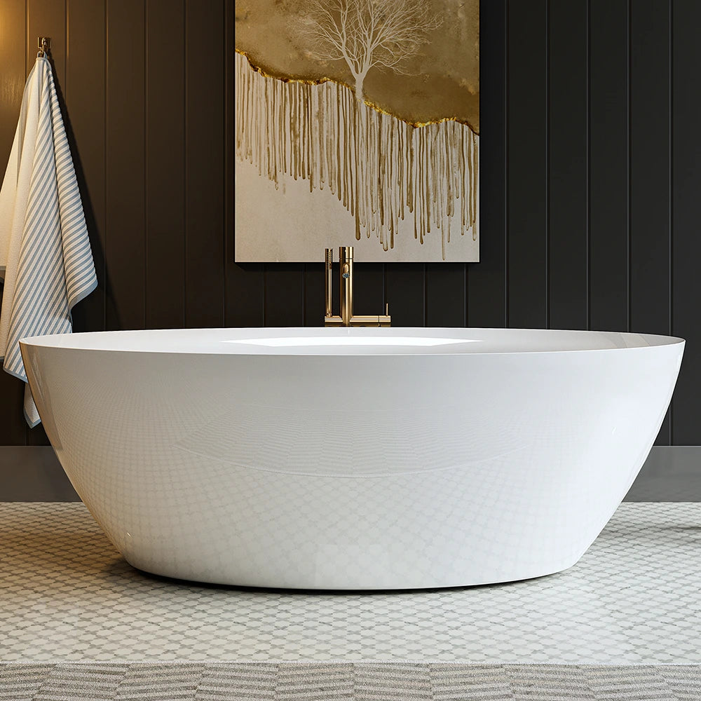 A modern bathroom showcases a 71" Freestanding Soaking Tub with Center Drain, boasting an ergonomic design and a sleek, white, rounded acrylic construction. The wall behind is dark and adorned with a large abstract painting in shades of gold and white. To the left, a striped towel hangs on a hook, while the floor is accented with a patterned rug.