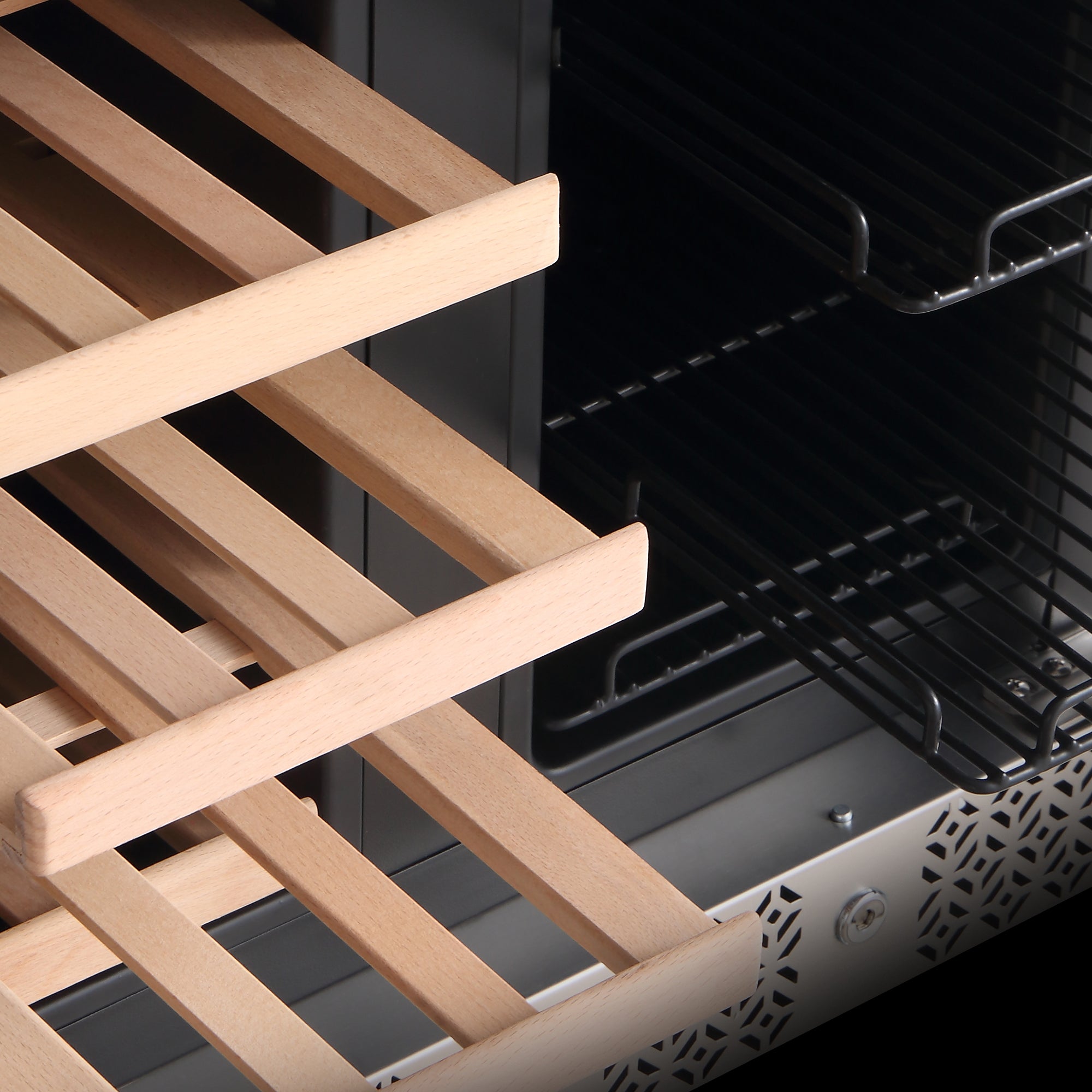 Close-up of an Empava 24" Dual Zone Wine and Beer Fridge Beverage Cooler, showcasing wooden shelves in the foreground and metal wire racks in the background. The wooden shelves are partially pulled out, revealing the black, ventilated interior of the fridge.