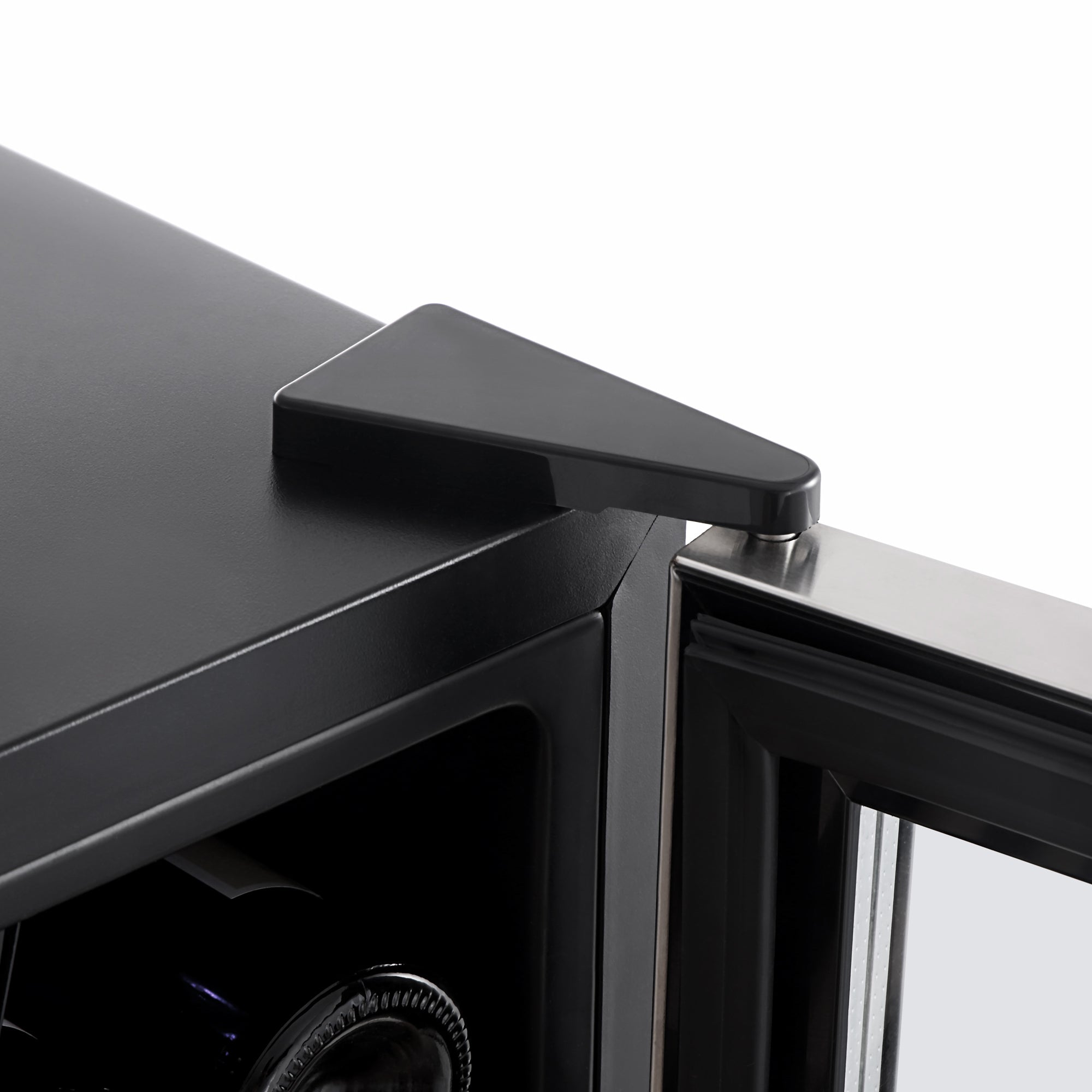 Close-up view of a black corner shelf featuring modern triangular bracket details and a partially open glass door, showcasing sleek and minimalist design elements reminiscent of the Empava 24" Wine Cooler 55" Tall Wine Refrigerator.