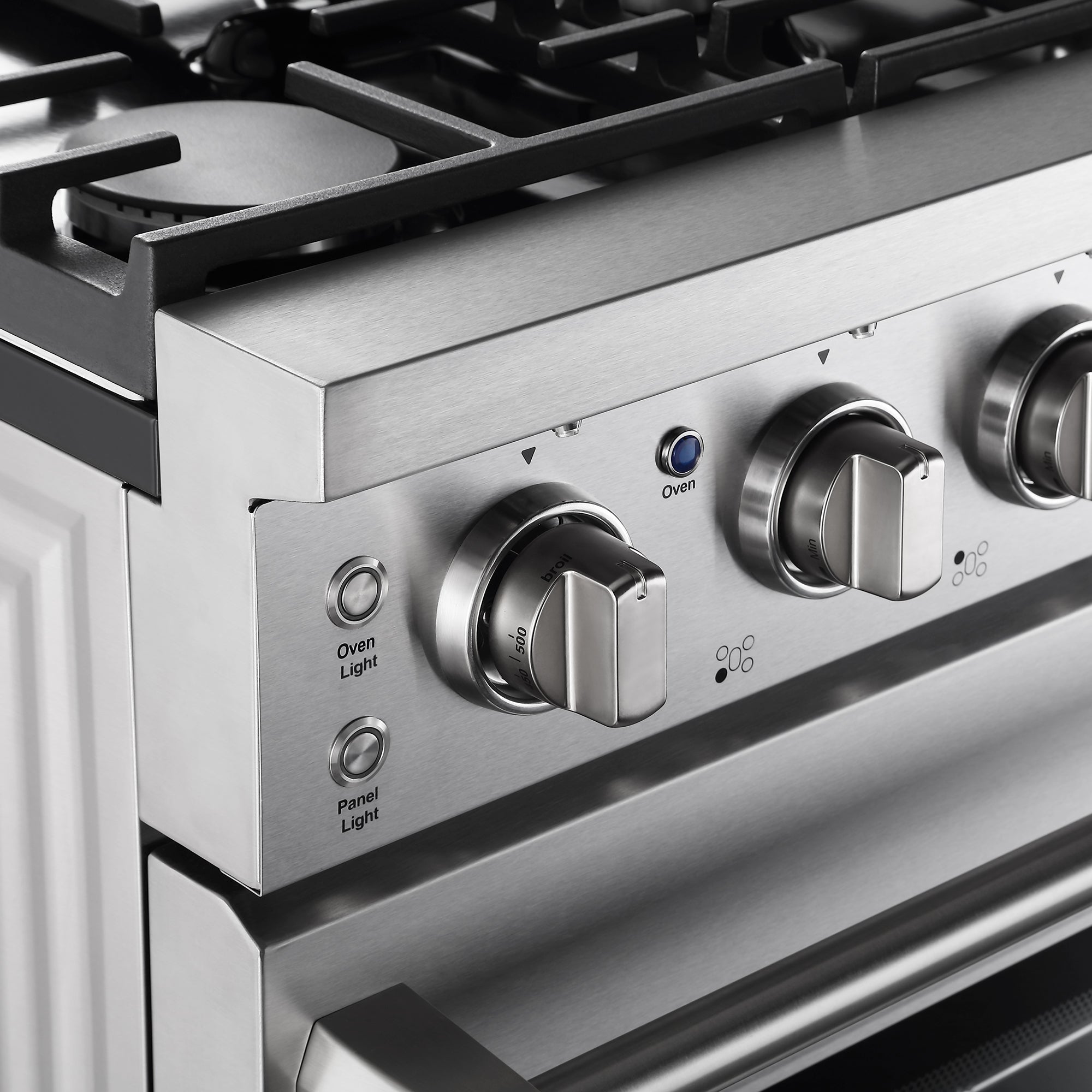 Close-up of the Empava 30 In. Pro-Style Slide-in Single Oven Gas Range, featuring three control knobs labeled for oven temperature and cooking functions. Indicator lights next to the knobs are marked "Oven Light" and "Panel Light." The gas range boasts a sleek and clean stainless steel design.