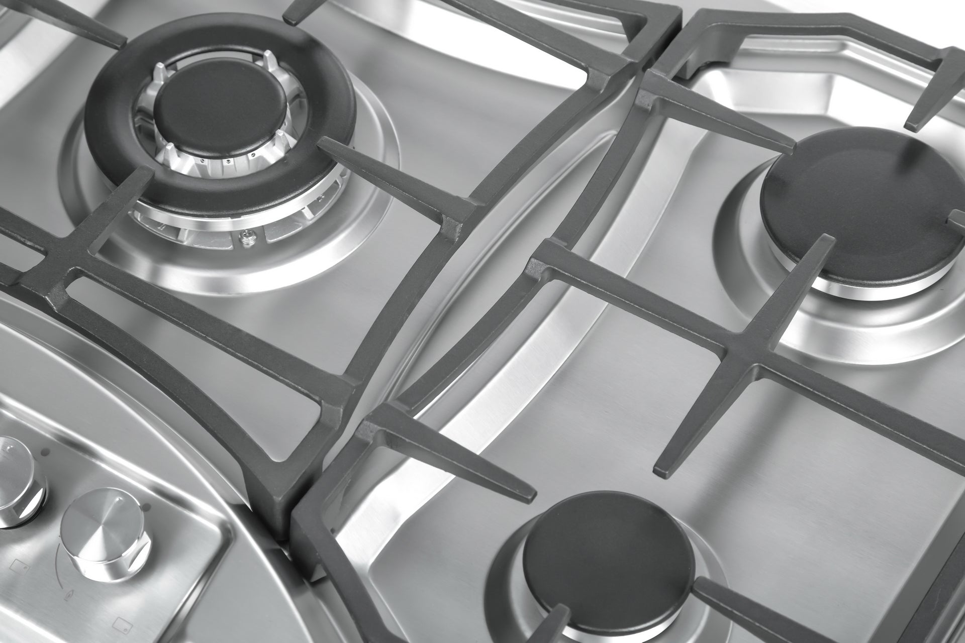 A close-up view of the Empava 36 in. Built-in Gas Cooktops showcases a stainless steel gas stove featuring four burners with powerful BTU output. The image displays two large burners and two smaller burners, all covered by black grates. Knobs for controlling the burners are visible on the left side of the stove, compatible with both LPG and NG energy sources.