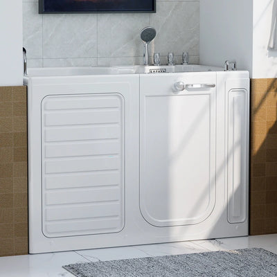 A 54" Alcove Inline Heater Whirlpool Walk-in Tub 2.0 Upgraded with Right Drain, featuring a hinged door and an internal handle, is installed in a tiled bathroom. The tub is equipped with a handheld showerhead connected to the faucet, and the floor includes a partially covered textured gray mat. The surrounding walls are adorned with light and brown tiles.