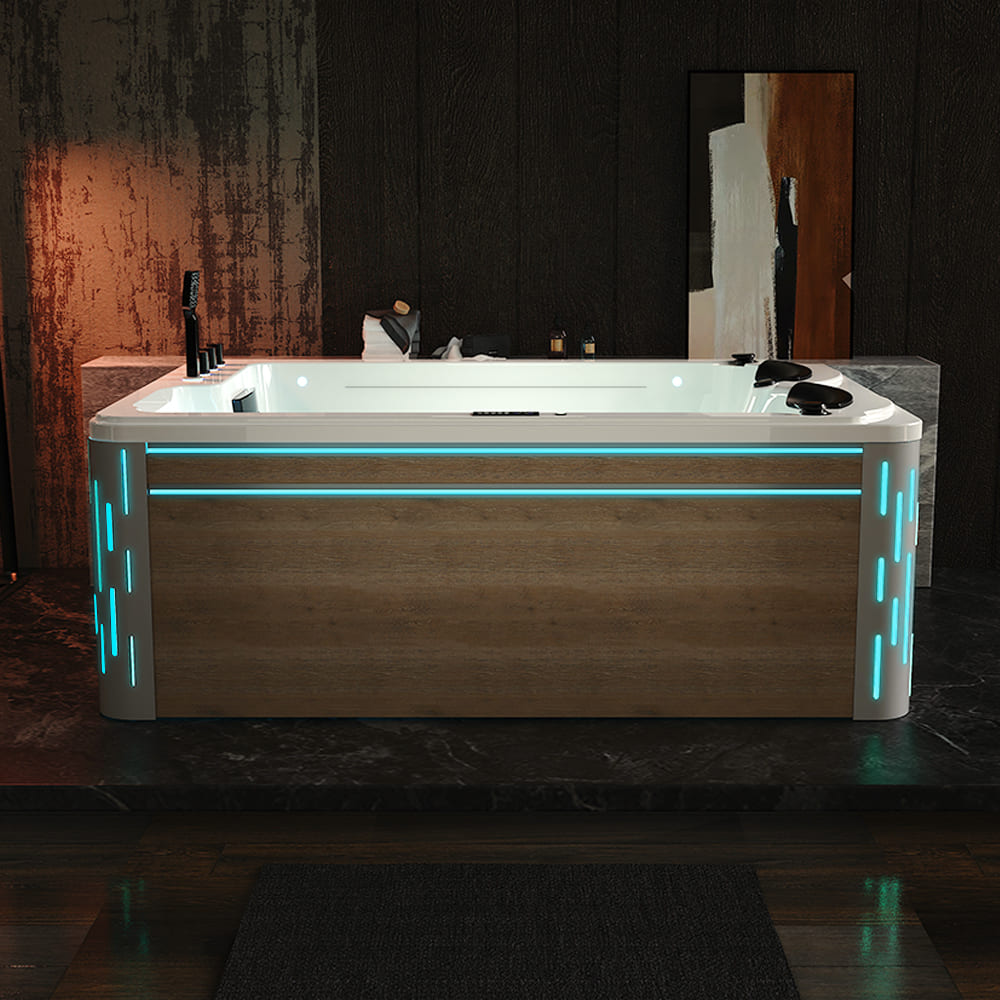 A modern 75-inch, freestanding luxury thermostatic rectangular bathtub with wooden paneling and blue LED accent lights from Empava is set in a dimly lit bathroom with dark brown, textured walls. This environmentally friendly bath features ozone disinfection. The accessories include soap bottles, and there's a large framed mirror leaning against the back wall.