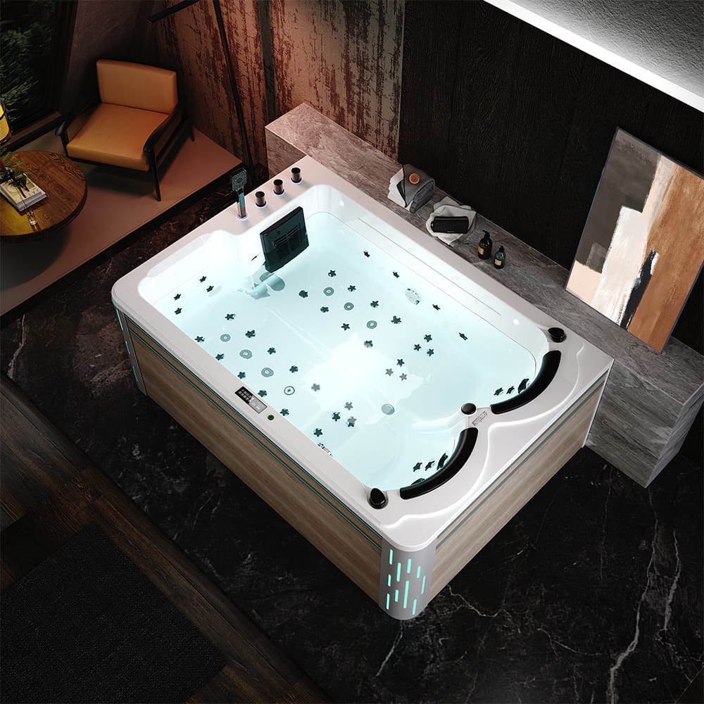 Top-down view showcasing the Empava 75 in. Freestanding Luxury Thermostatic 2-Person Rectangle LED Tub With Right Drain, equipped with various water jets, LED lighting, and controls, elegantly placed in a stylish bathroom featuring dark marble floors, wooden walls, a comfortable armchair, and a small table adorned with decorative items.