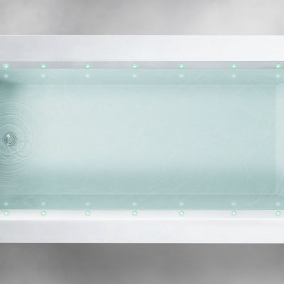 Top view of a rectangular Custom Function bathtub filled with clear water. Small green LED lights line the inner rim, evenly spaced along the length and width of the tub. The bathtub is set against a light gray, textured background.