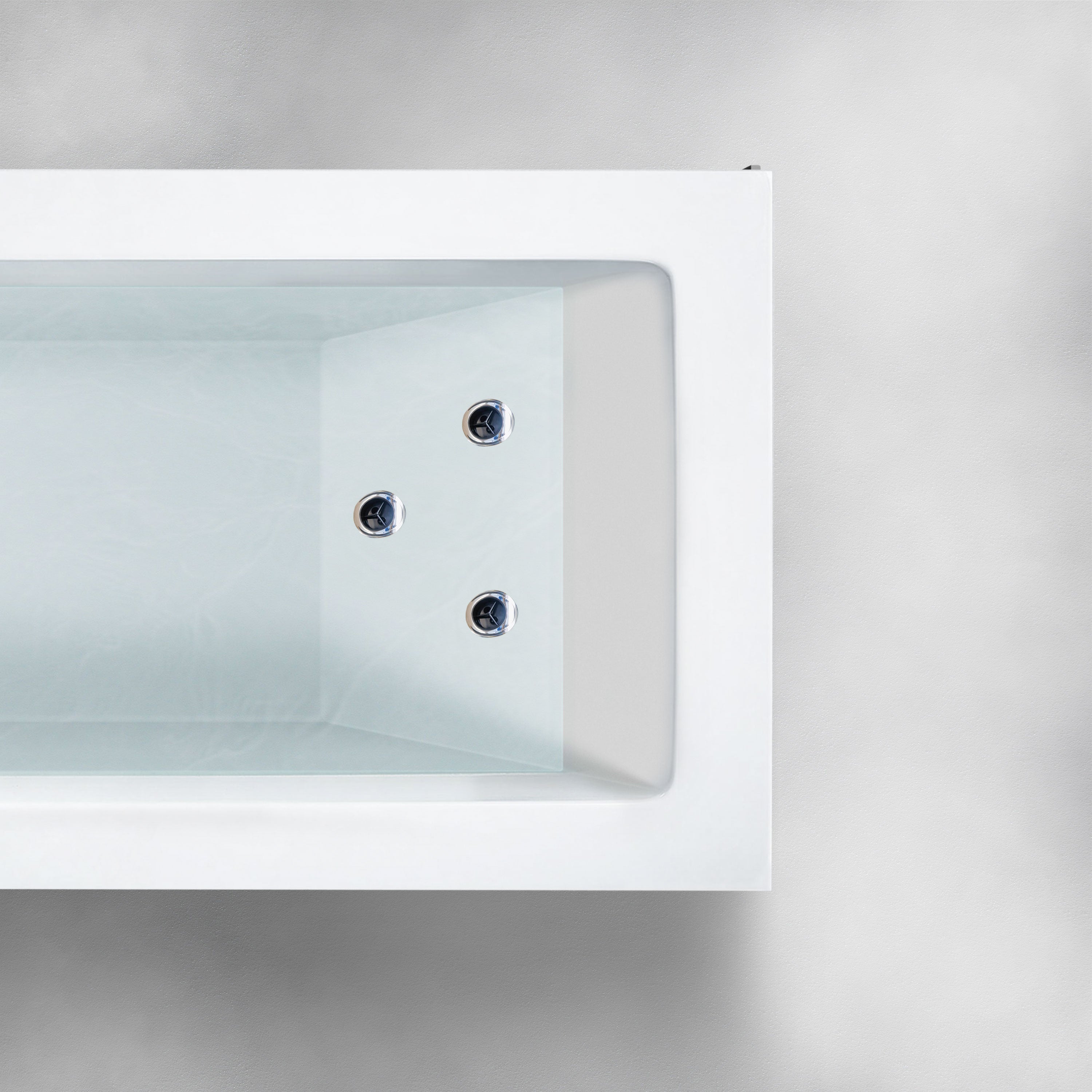 A top-down view of the Custom Function bathtub, rectangular and white, featuring three chrome jet fixtures on one side. The tub is empty and set against a neutral, light gray background. The interior boasts a smooth, glossy finish.