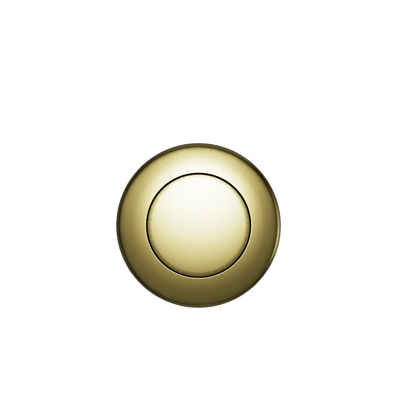 A Custom Drain Cap Finish featuring a shiny, round, gold-colored design with a slightly recessed center on a black background.